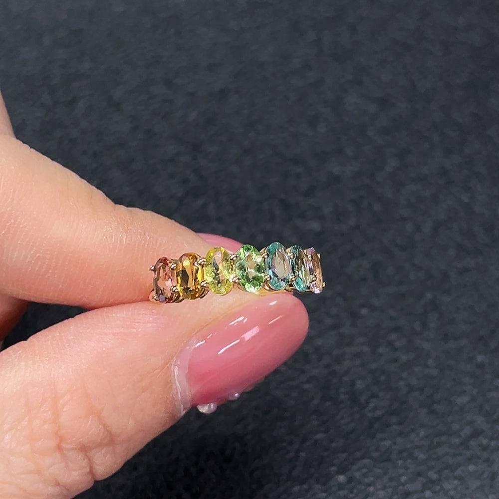 Huiliu certified gemstone tourmaline ring with no marks, showcasing a vibrant, polished gemstone in a silver setting.