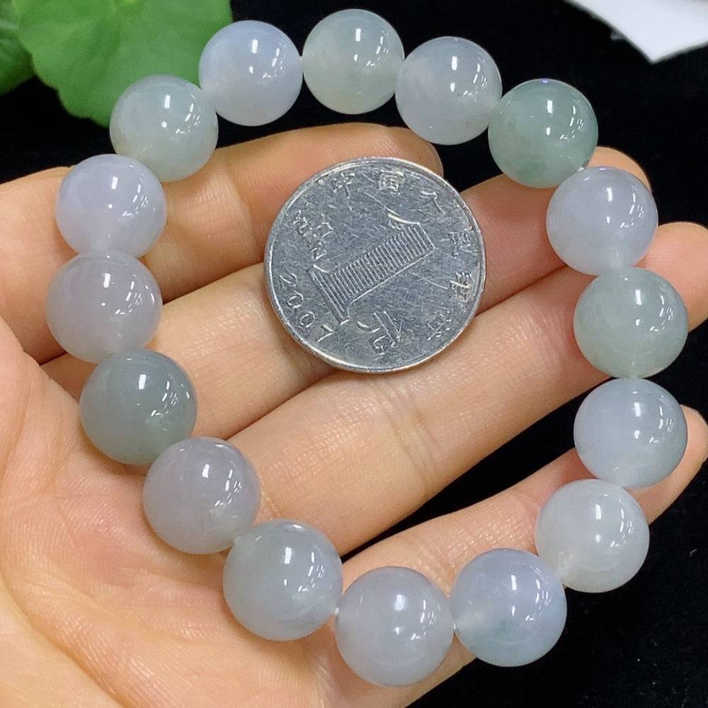 HUILIU HQ jadeite bracelet with 12.2mm smooth polished jade beads, certified by Huiliu, showcasing elegant craftsmanship and natural jade color.
