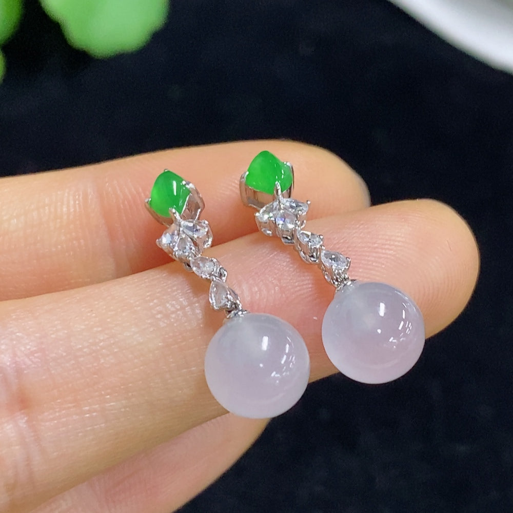 Jadeite earrings set in 18K gold with diamond accents