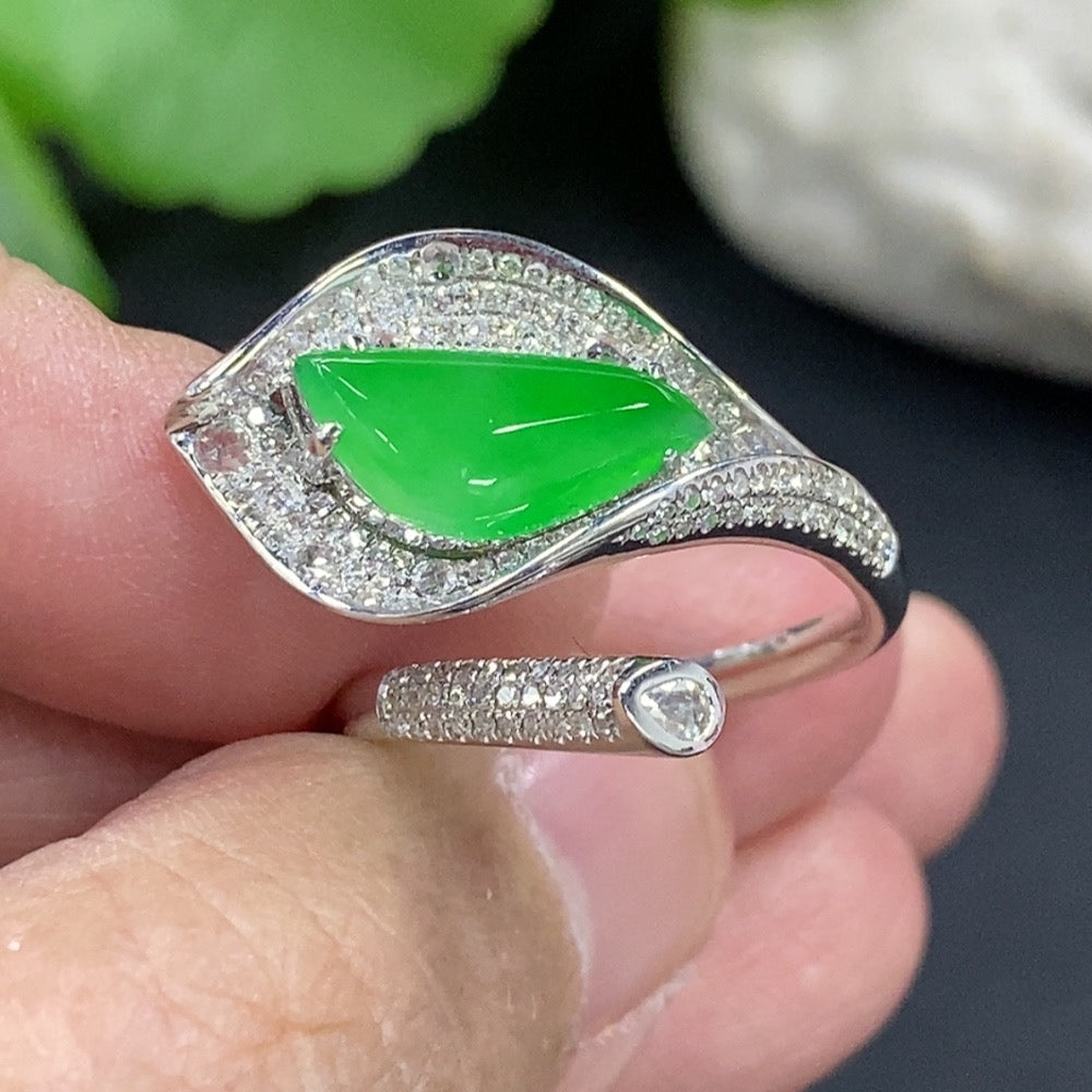 Jadeite freeform inlaid ring with 18K gold band and diamond accent from HKHQ, showcasing intricate design and vibrant green jadeite.