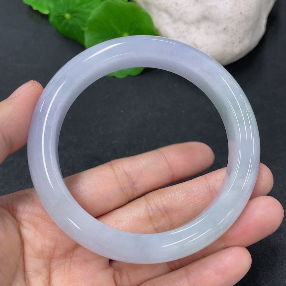 HKHQ Jadeite round bangle in size 56.5, weighing 63.79g, showcasing smooth, polished jadeite bracelet with vibrant green color.