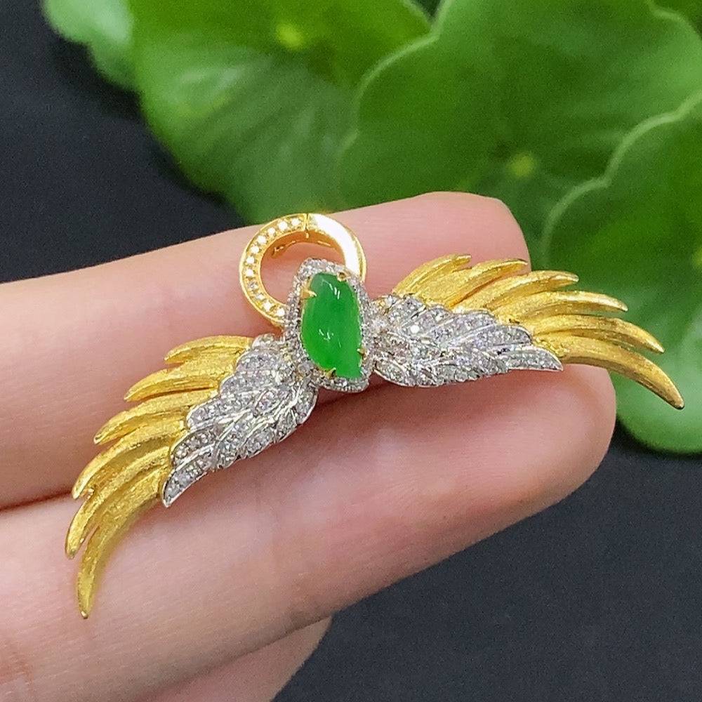 Jadeite inlaid brooch with 18K gold and diamond accents, featuring a carved jade design, weighing approximately 5.6 grams.