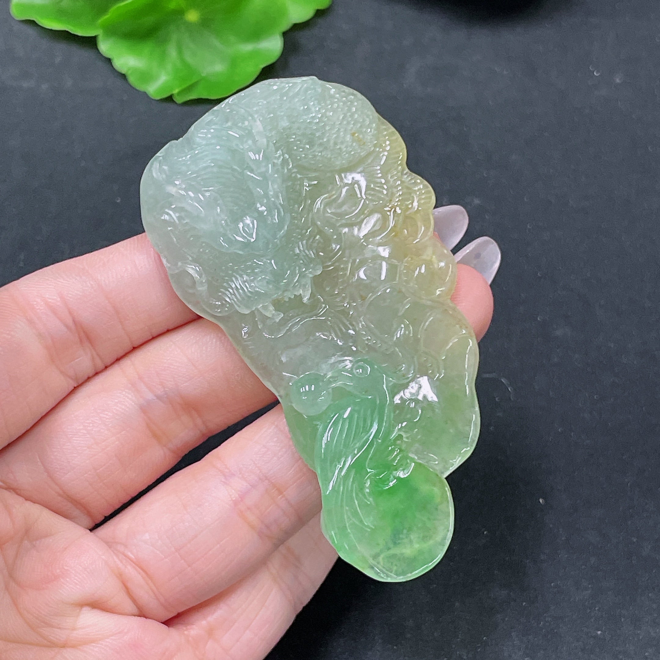 Jadeite pendant featuring a dragon plaque with intricate carvings, weighing approximately 36.62g, from HUILIU HQ.