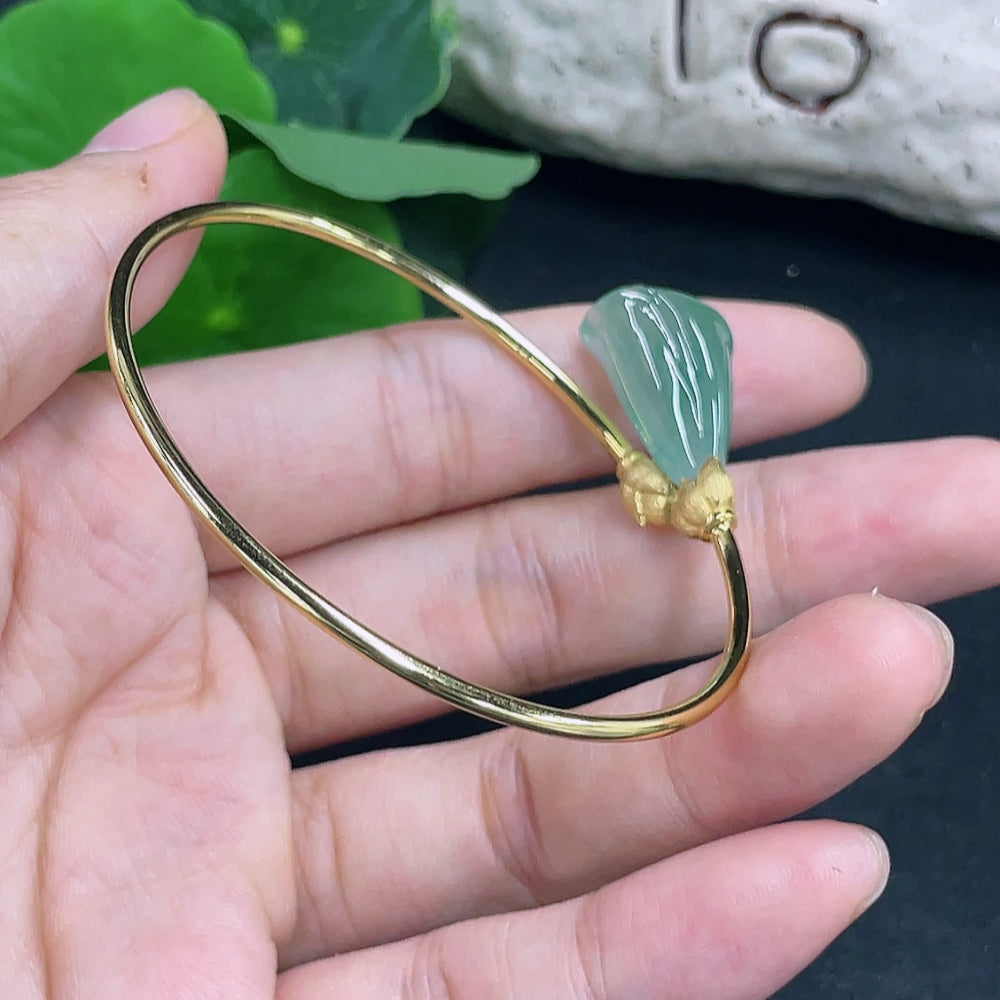Jadeite inlaid bracelet with 18K gold accents from HKHQ, featuring intricate jadeite patterns and elegant bracelet design.