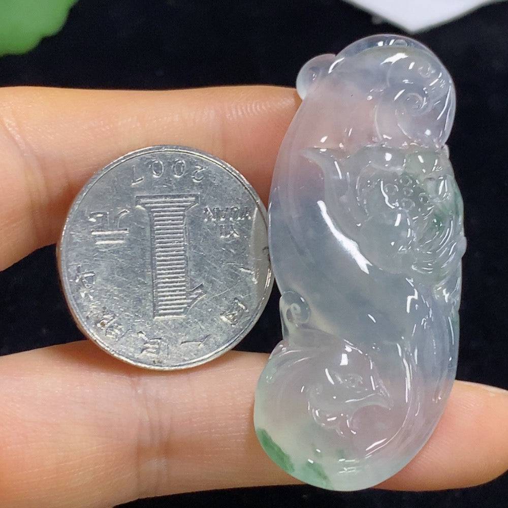 Jadeite lotus pendant from HUILIU HQ, intricately carved with a detailed lotus design, weighs approximately 16.26 grams.