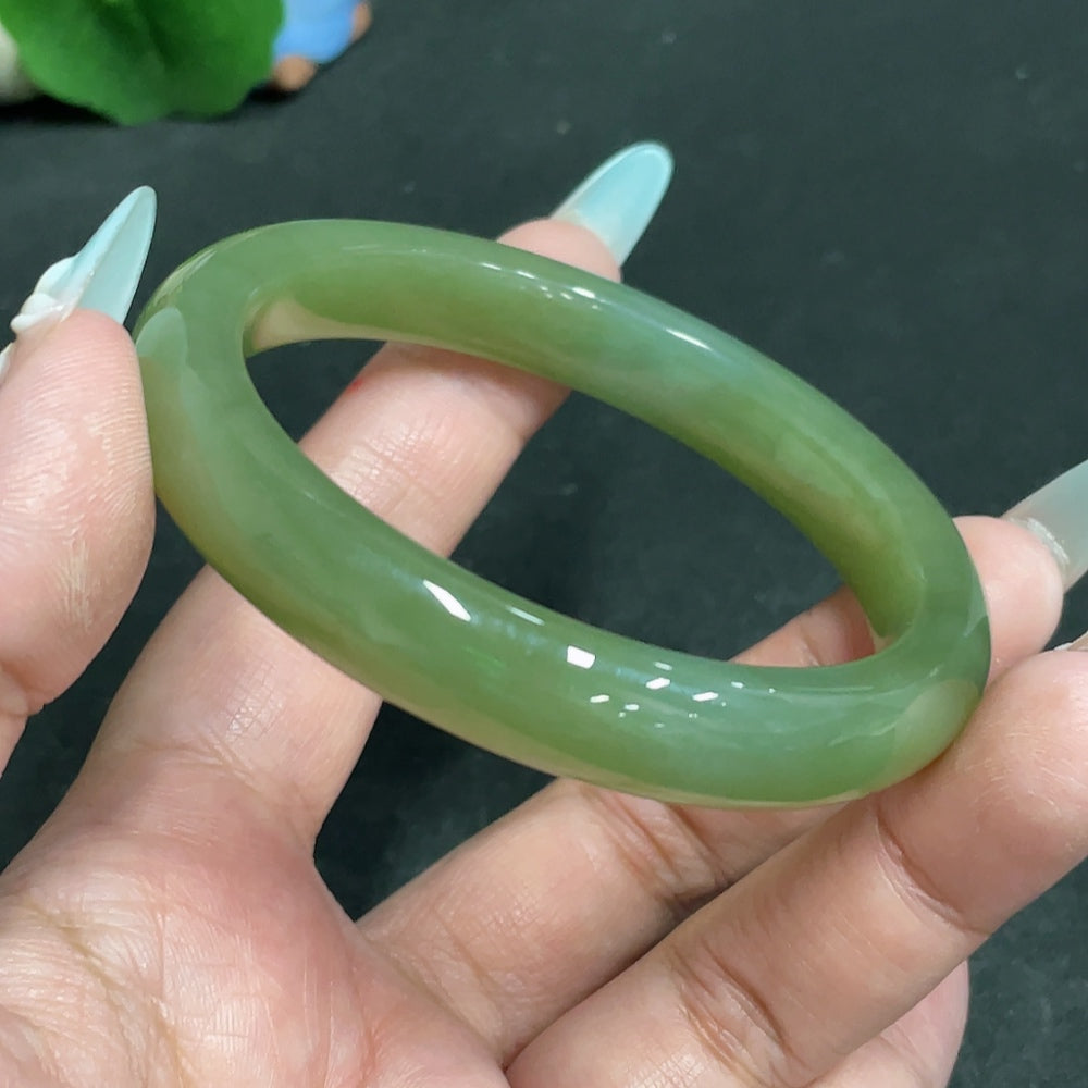 Huiliu certified Hetian jade round bracelet featuring smooth, polished green jade beads on a stretch cord.