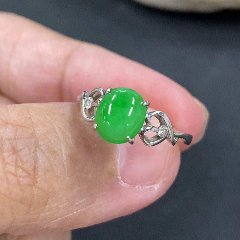 Jadeite cabochon ring in 18k gold setting, HKHQ, size 11.5, featuring a smooth green jade stone and a gold band.