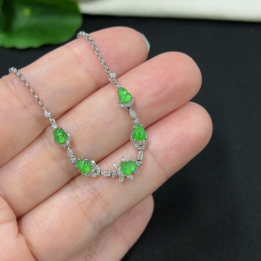 Jadeite gourd bracelet with 18k gold inlay and diamond accents, weighing approximately 2.89 grams, by HKHQ.