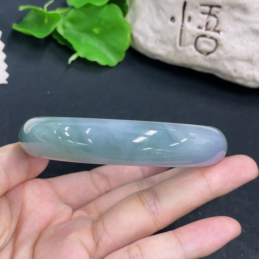 HKHQ Jadeite round bangle, size 65, 83.3g, showcasing smooth, polished jadeite bracelet with a round shape and vibrant green color.
