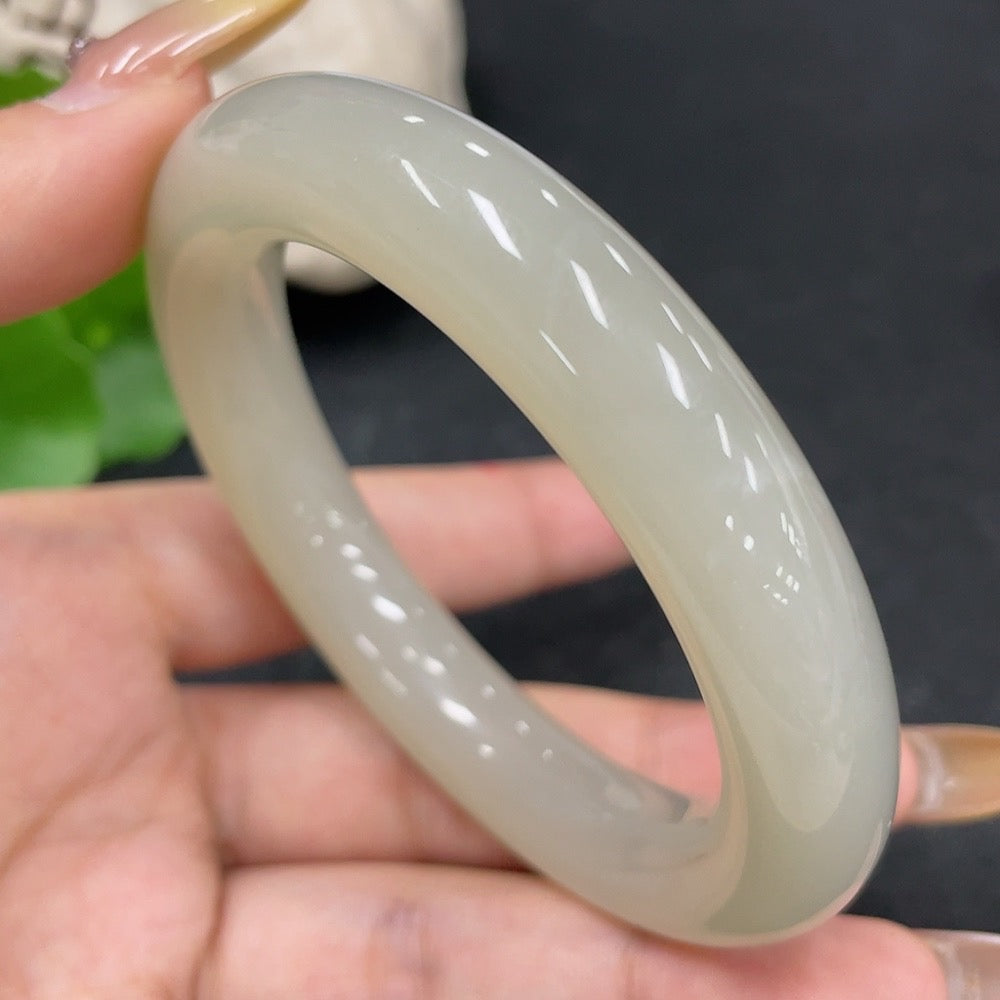 HKHQ Hetian Jade round bangle bracelet, size 54.7, weighing 66.8g, showcasing smooth jade surface and elegant craftsmanship.