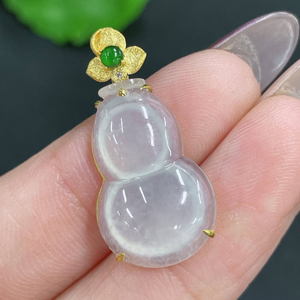 Huiliu Jadeite pendant in the shape of a gourd with inlaid design, crafted from high-quality jade, certified by Huiliu HQ.