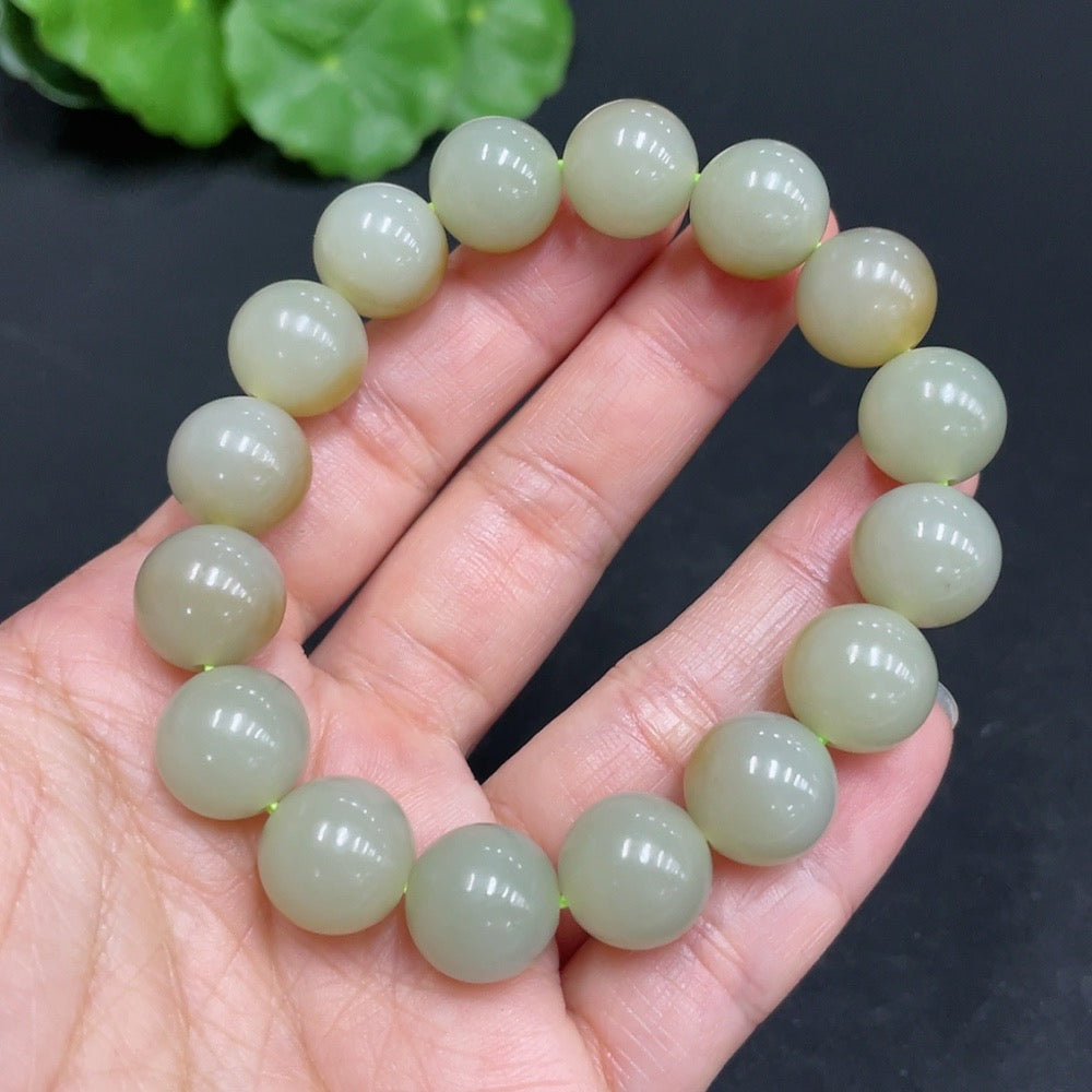 Hetian Jade bracelet by HUILIU HQ with 11.9mm stones, showcasing smooth, polished jade beads and a substantial 41.7g weight.