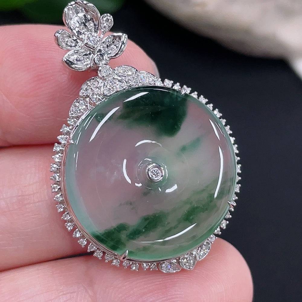 Jadeite peace knot pendant by HUILIU HQ with 18K gold accents and diamond details, showcasing intricate craftsmanship and smooth jade surface.