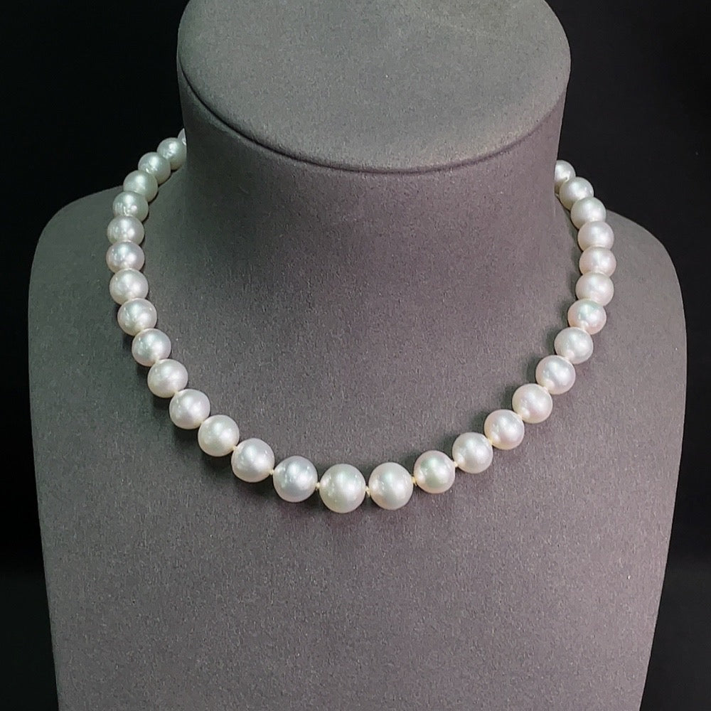 Elegant saltwater pearl strand necklace with 14K gold clasp, featuring lustrous pearls and classic design from HKHQ.