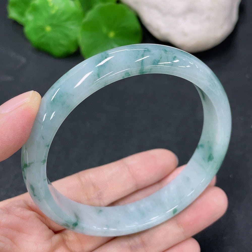 Round jadeite bracelet with a 59.5mm diameter, weighing approximately 48 grams, featuring smooth polished jade stones.