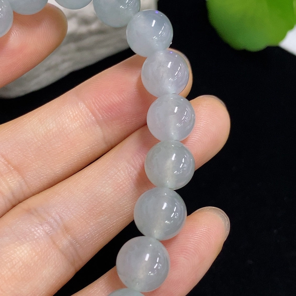 HKHQ jadeite bracelet weighing 28.68g with smooth, polished green jadeite beads on a string.