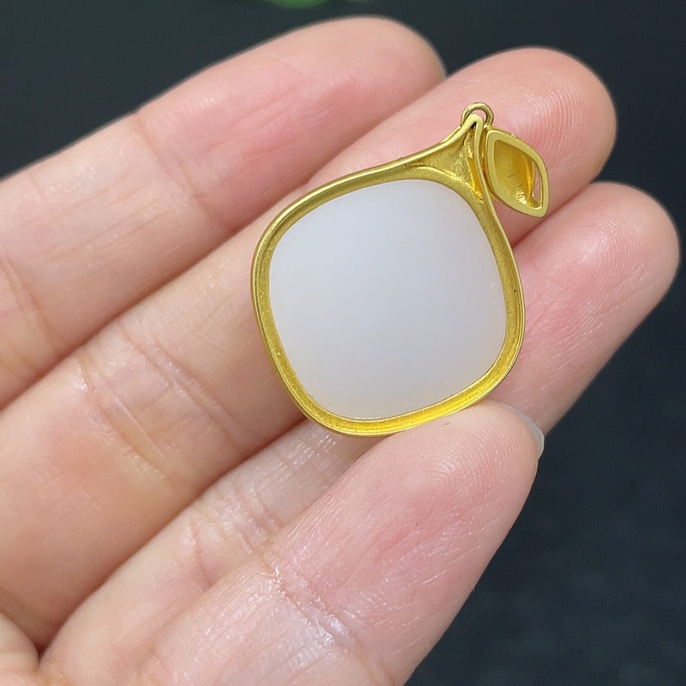 Hetian jade inlaid pendant with 18K gold setting, HKHQ necklace showcasing a smooth, polished jade stone on a delicate chain.