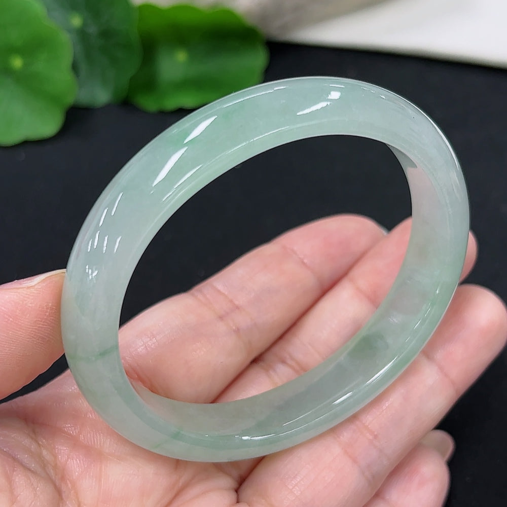 HKHQ jadeite concubine bracelet with carved design, size 56.2/48.4, weighing approx. 41.1g, showcasing elegant jade craftsmanship.