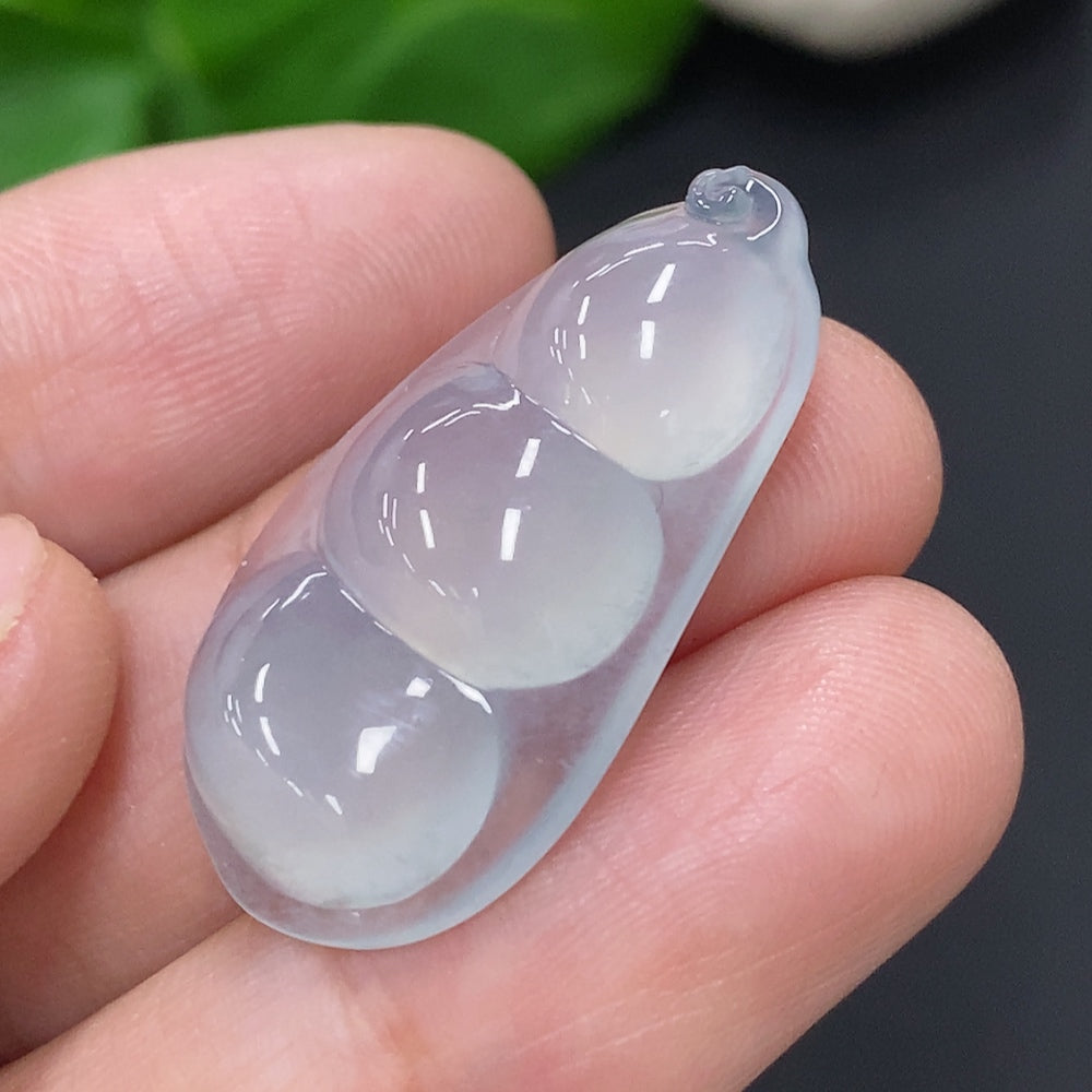Huiliu Jadeite blessed bean inlay piece with intricate jade craftsmanship, certified by Huiliu HQ.
