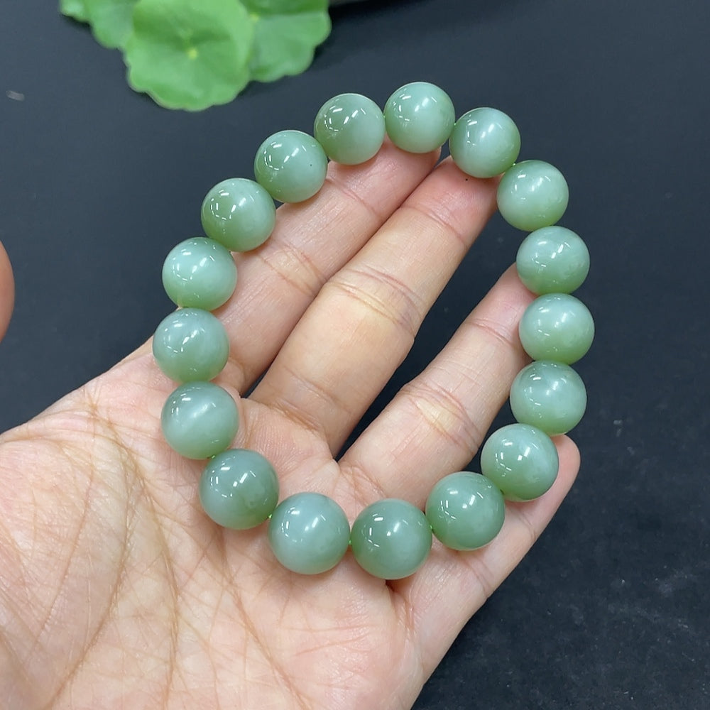 HKHQ Hetian Jade bracelet with 11.6mm round jade beads, weighs approximately 43g, showcasing smooth, polished natural jade.