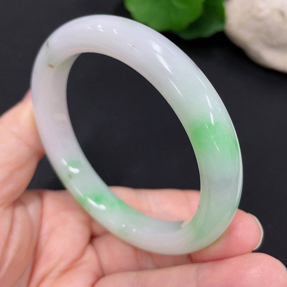 Huiliu Jadeite round bangle, certified jade jewelry with smooth, polished surface and natural green hues.