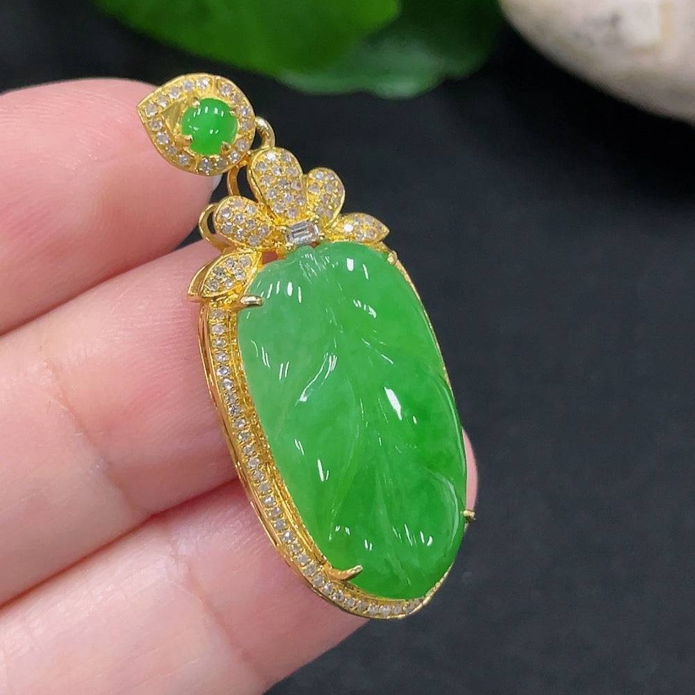 Jadeite leaf inlay pendant with diamond accents, 18K gold, from HUILIU HQ, showcasing a detailed jade leaf design featuring gold and diamonds.