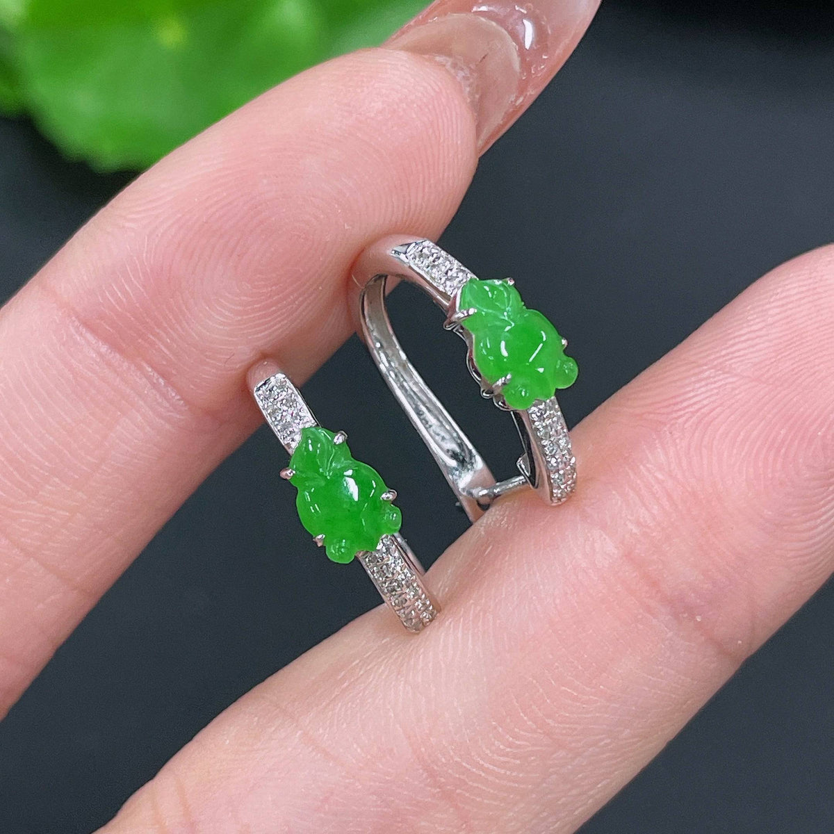 HUILIU HQ jadeite earrings set in 18k gold with diamond accents, showcasing elegant jade jewelry with sparkling details.