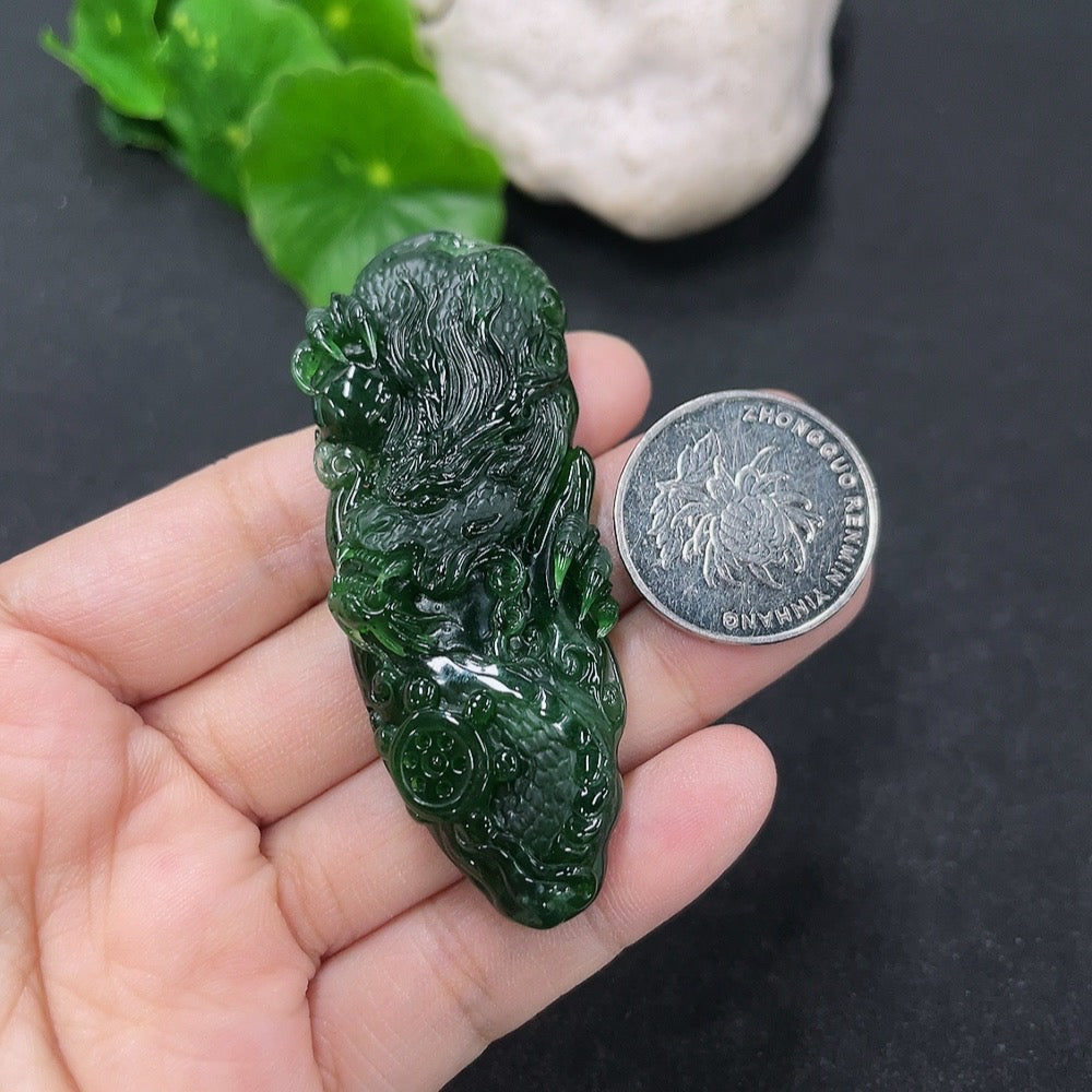 Jadeite pendant featuring a dragon plaque in green jade, weighing approximately 21.95g, from HKHQ.