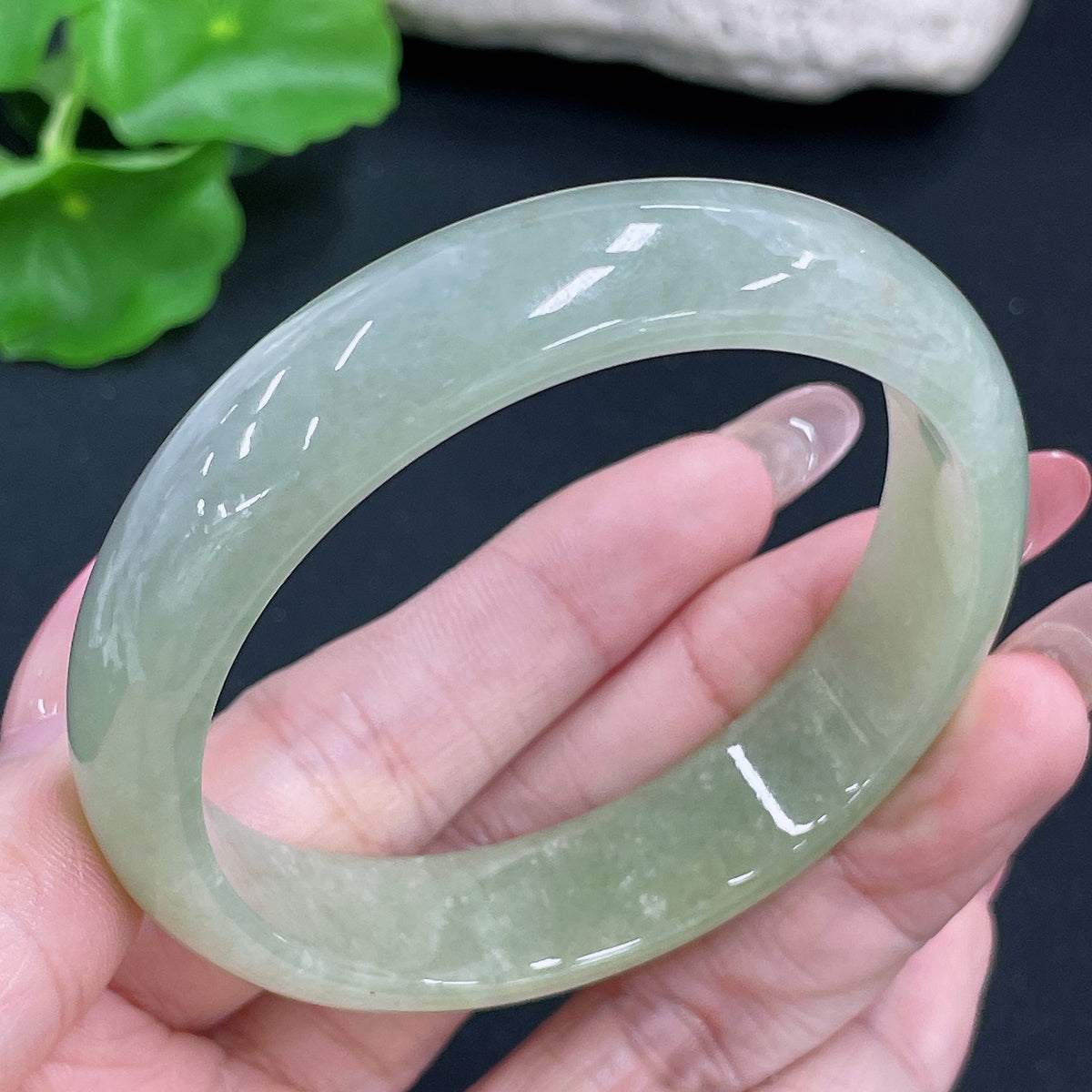 Jadeite round bracelet with 51.42g weight and size 56.8, featuring smooth, polished jade stones from HKHQ.