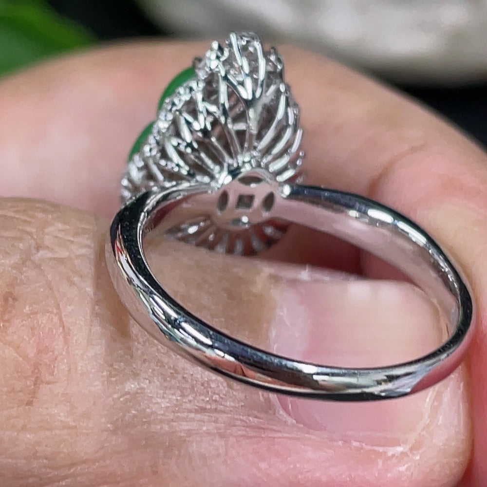Jadeite gourd inlaid ring with 18K gold setting and diamond accents, featuring intricate craftsmanship and elegant design.
