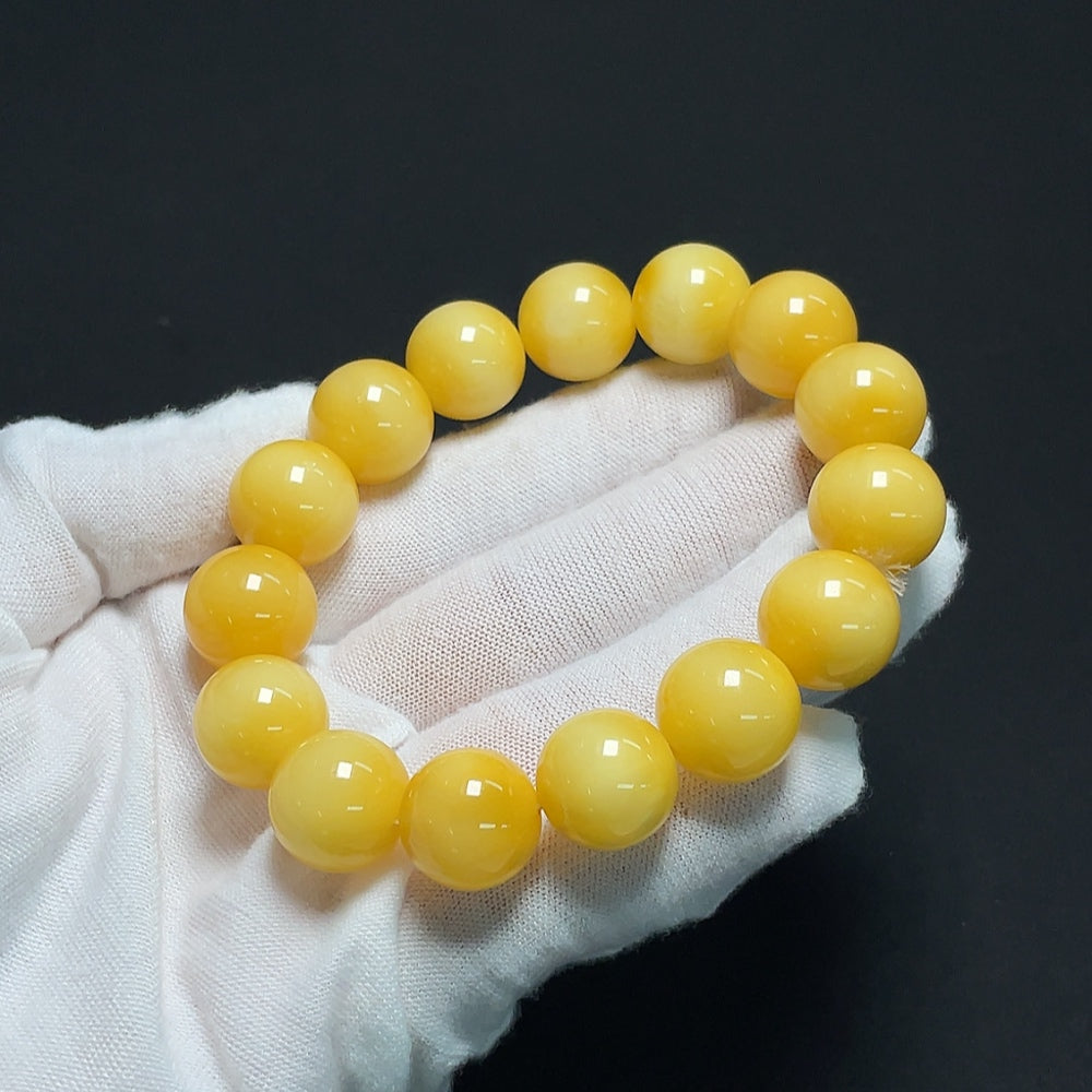 Amber Beeswax Bracelet from HKHQ featuring 13.9mm amber beads, total weight approximately 23.61g, natural warm honey color.