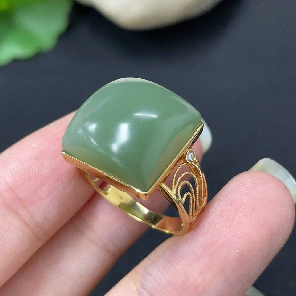 HKHQ Hetian Jade inlaid ring with diamond accents and 18K gold band, showcasing intricate craftsmanship and elegant design.