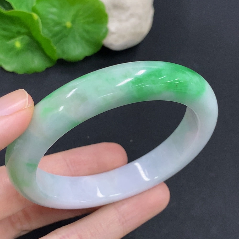 HKHQ jadeite round bangle with a 57.3mm size and 60.6g weight, showcasing smooth, polished green jadeite bracelet.