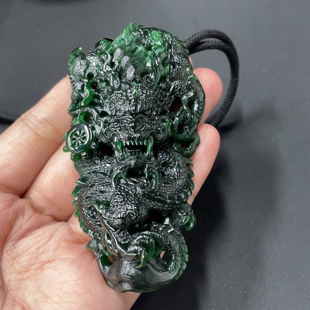 Huiliu Jadeite Dragon Pendant featuring a detailed carved jade dragon design on a smooth green jade surface.