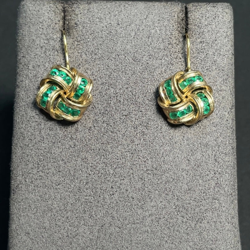 Emerald gemstone earrings in 9K gold with enhanced clarity, featuring a total weight of approximately 4 grams.