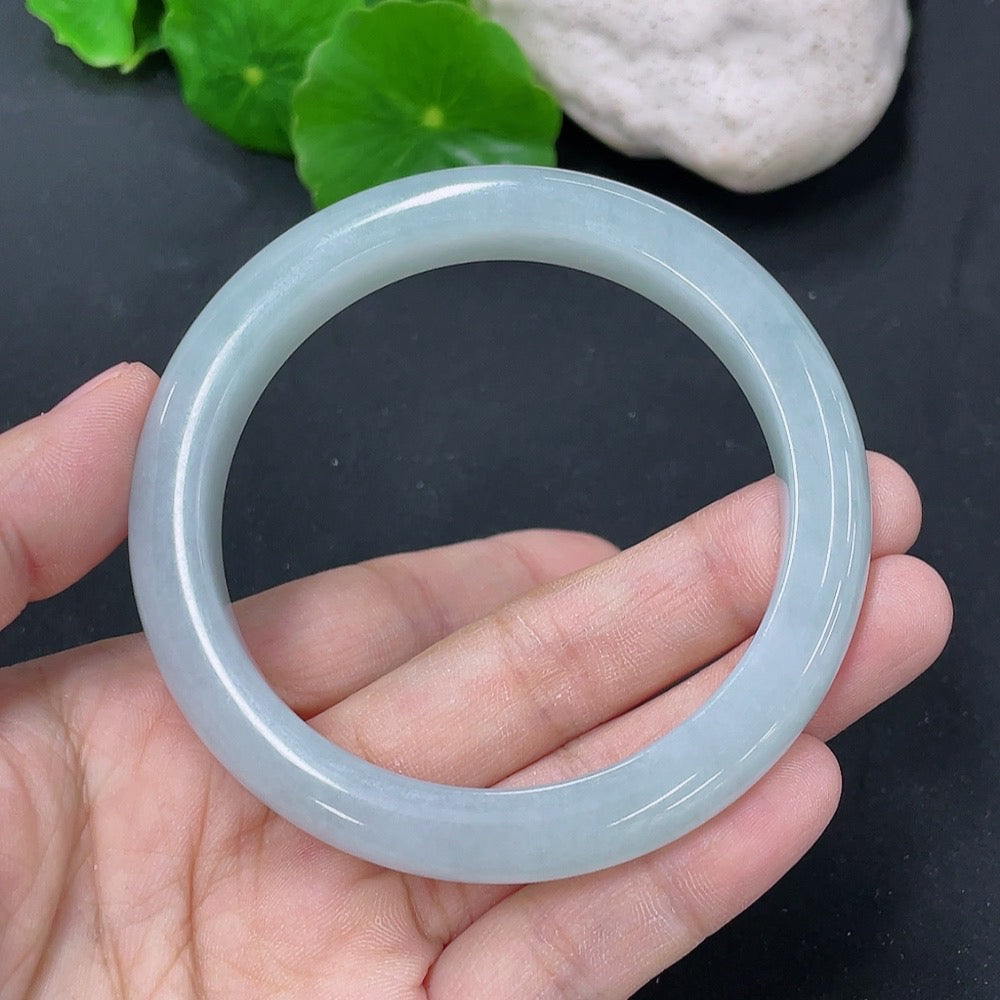 Jadeite round bangle with a 55.2mm diameter and 44.76g weight, crafted by HKHQ, showcasing smooth, polished jade jewelry.