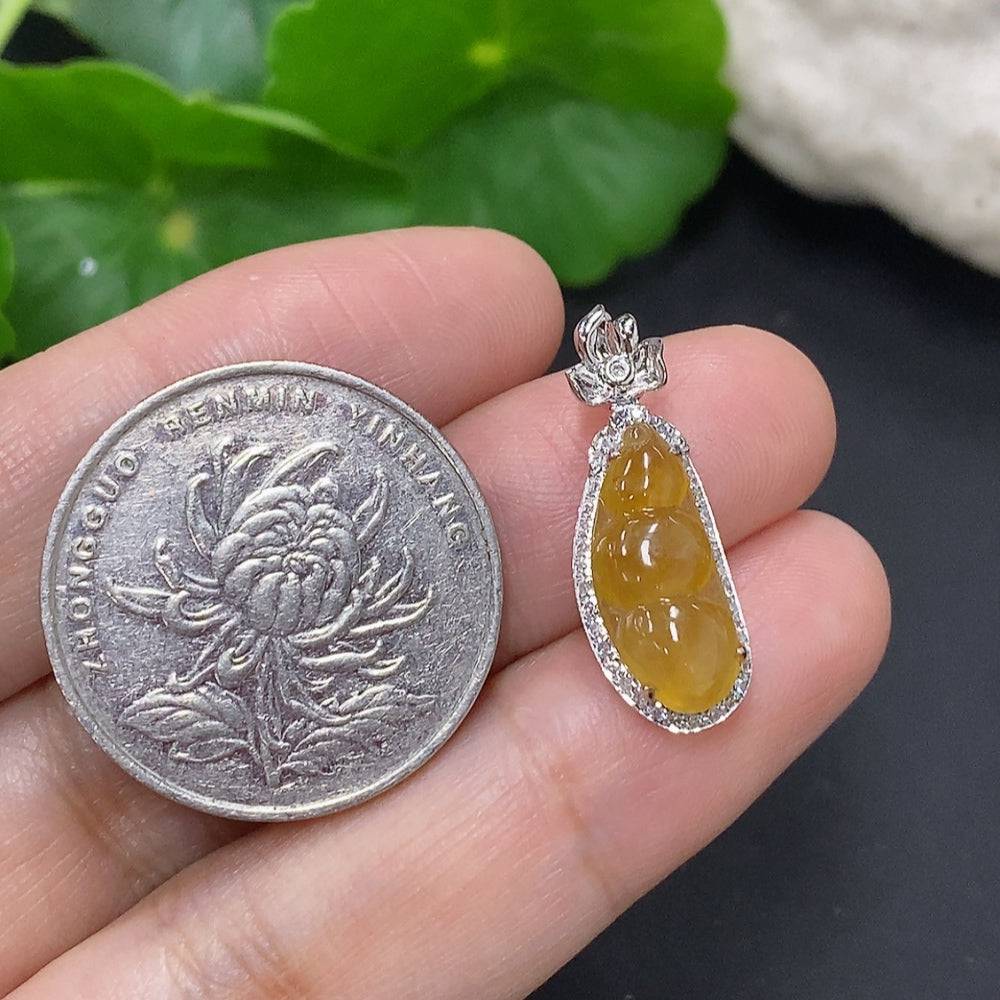 Jadeite blessing bean pendant in 18K gold with diamond accents, featuring a smooth green jade gemstone, crafted by HUILIU HQ.