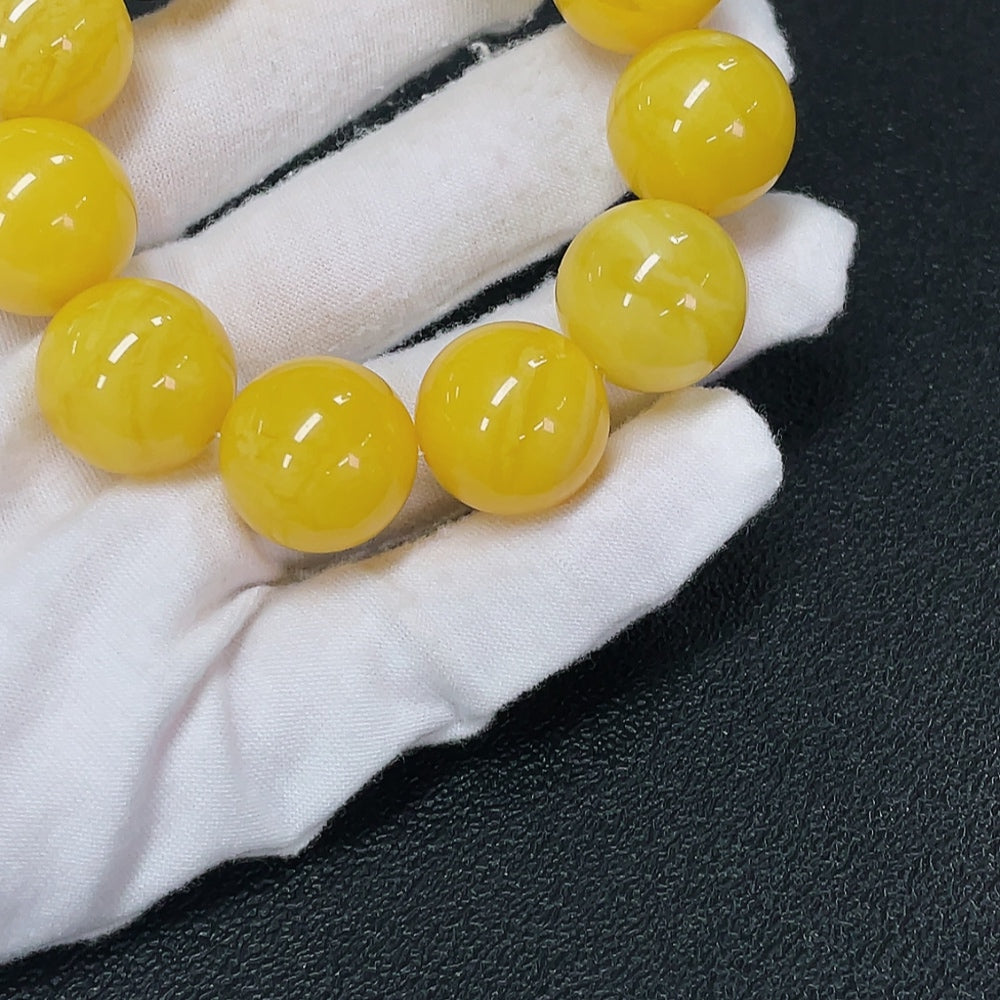 Amber Beeswax Bead Bracelet with natural gemstones, approx. 18.3mm beads, HKHQ brand, partially visible repairs in the image.