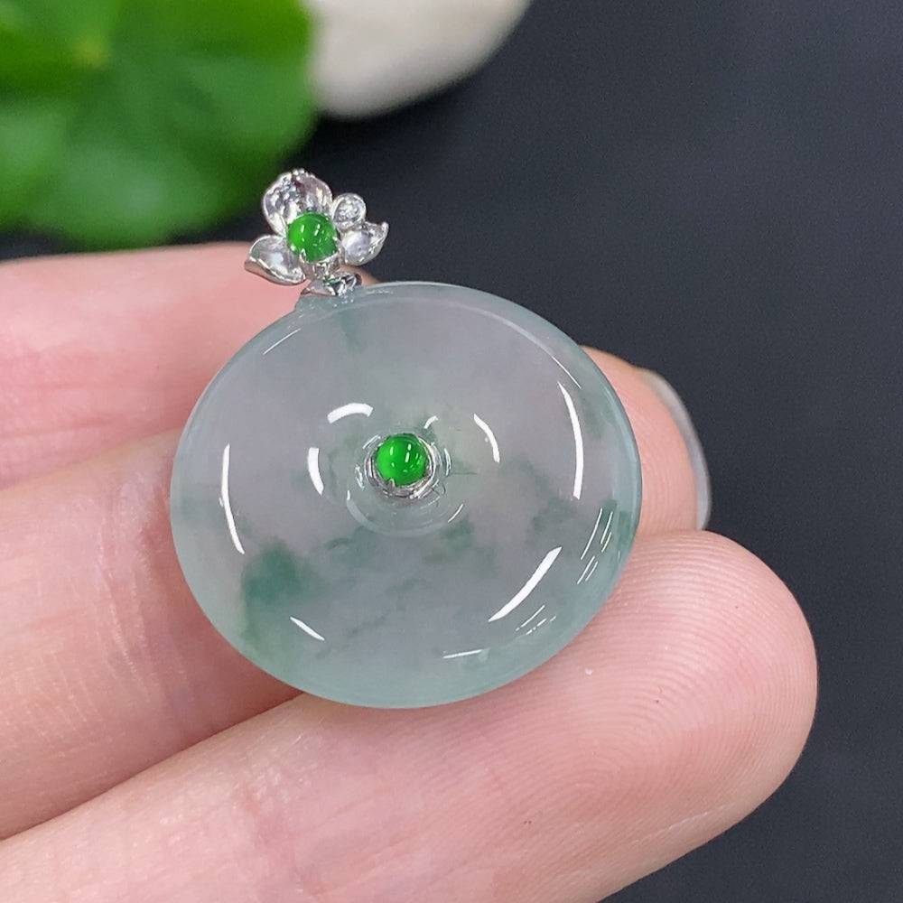 Jadeite peace knot pendant with 18K gold clasp, crafted from smooth green jade, weighing approximately 4 grams.