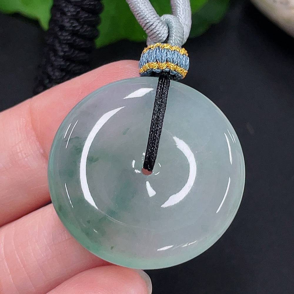 Jadeite Peace Knot pendant from HUILIU HQ featuring a smooth, polished jade pendant with intricate knot design, weighing approximately 10.38g.