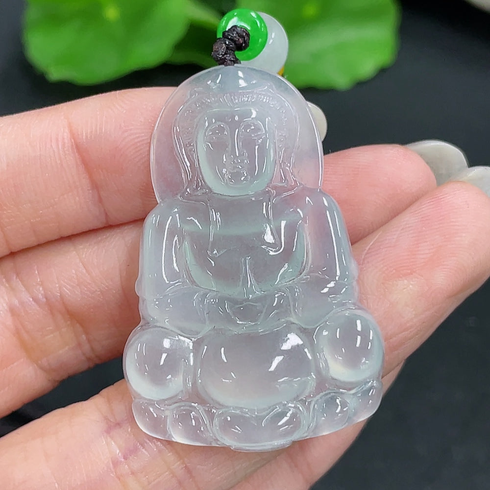 Jadeite Guanyin pendant on a rope necklace, showcasing detailed craftsmanship and smooth, polished green jadeite.