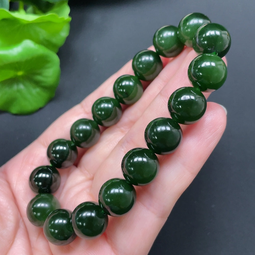 HKHQ Hetian Jade bracelet featuring 11.9mm beads and a total weight of 45.24g, showcasing smooth, polished jade stones.