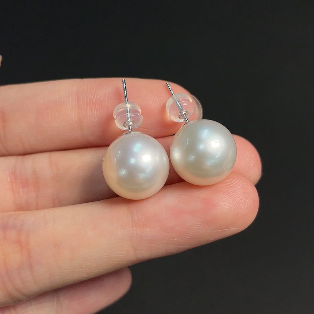 18k seawater pearl earrings by HUILIU HQ featuring 12.3mm lustrous pearls, total weight 6.23g on a clean background.