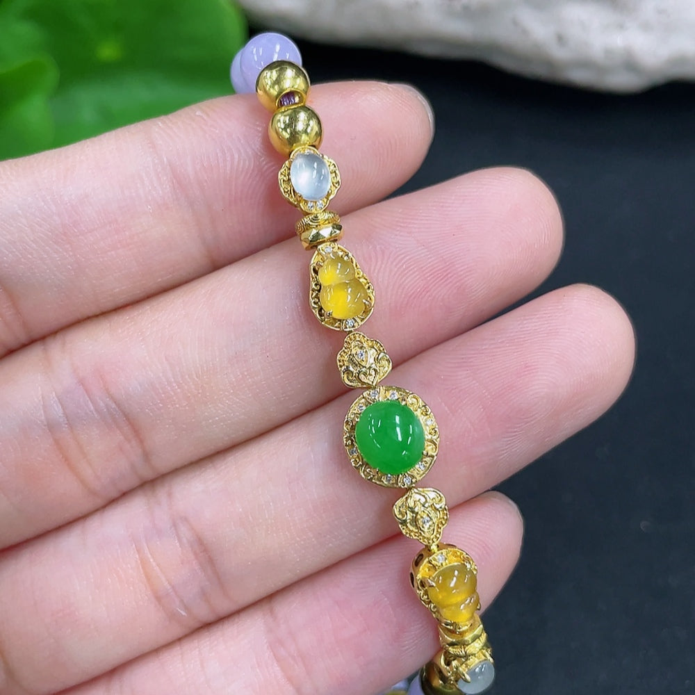 Jadeite bead bracelet with mixed gold components, featuring smooth green jade beads and gold accents, stylish jewelry accessory