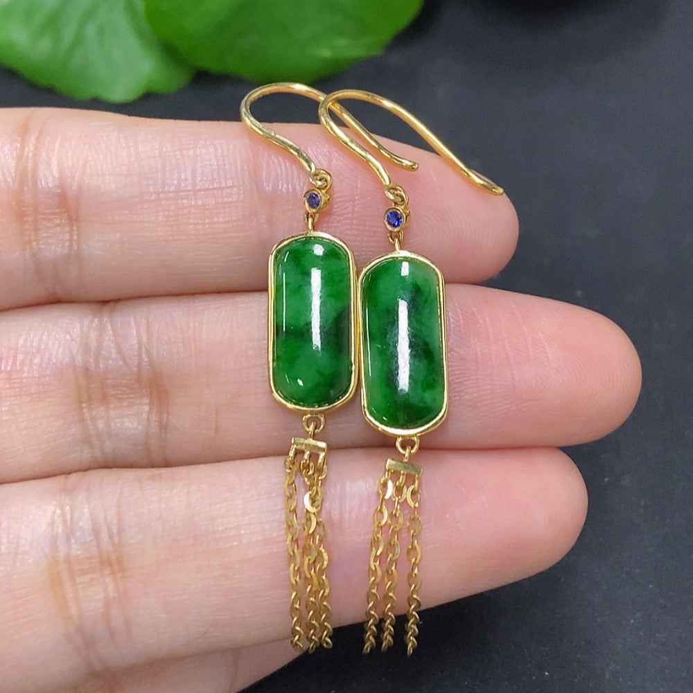 Jadeite earrings with 18K gold setting, featuring polished green jade stones and elegant gold hooks.