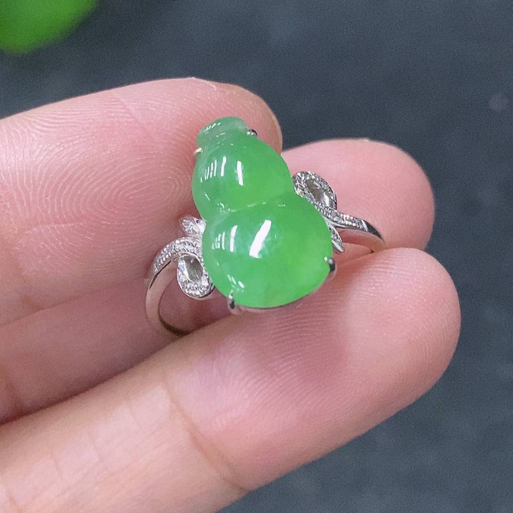 Huiliu Jadeite inlaid ring with diamond accents, featuring intricate craftsmanship and a polished finish.