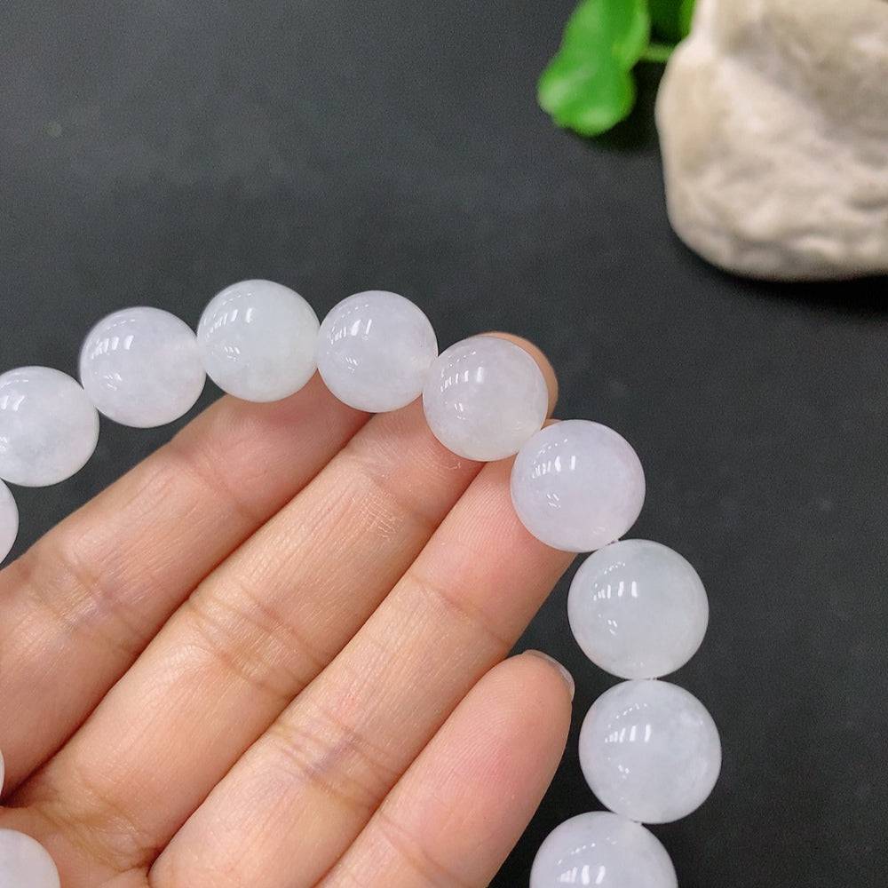 HUILIU HQ jadeite bracelet with 12mm beads, weighing approximately 48.69 grams, featuring smooth, polished green jade stones.