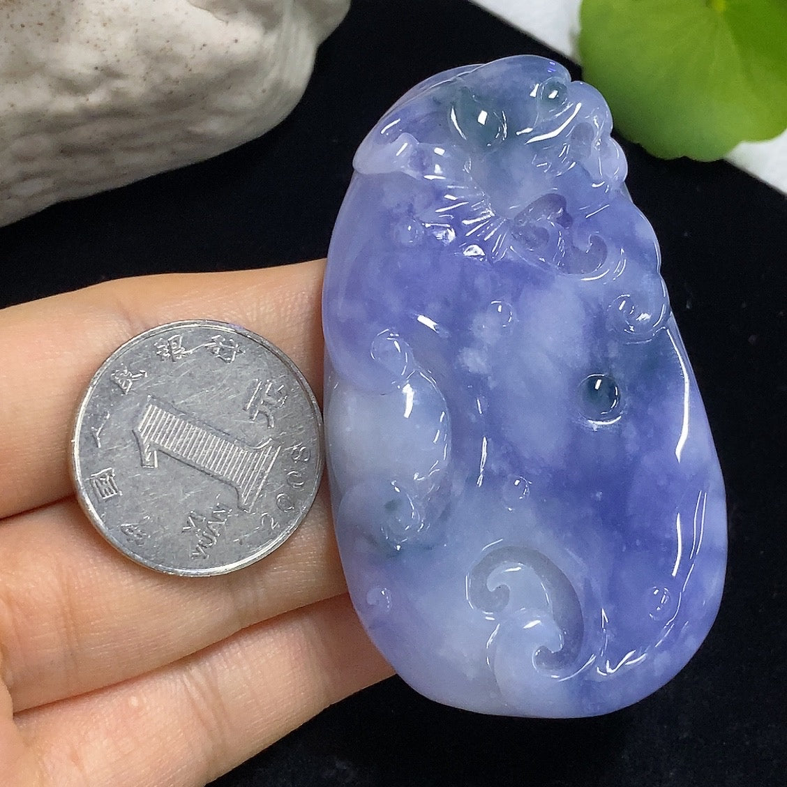 Jadeite Ruyi pendant weighing about 60.49g, crafted from green jade, showcasing intricate carving and elegant design.