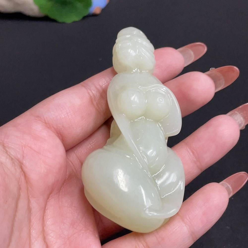 HUILIU HQ Hetian Jade handheld piece featuring intricate carvings, weighing approximately 76.4g, showcasing traditional craftsmanship.
