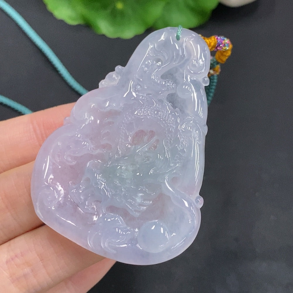Huiliu Jadeite Dragon Pendant featuring a soaring dragon design, crafted from green jadeite, with intricate detailing.